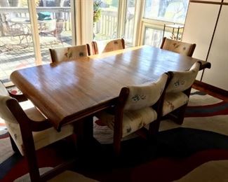 Solid wood Kitchen table with smooth lines and 6 upholstered chairs