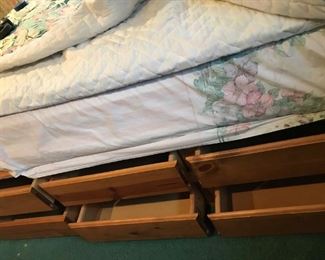 Queen Platform bed with 6 underbed storage drawers on each side of bed.