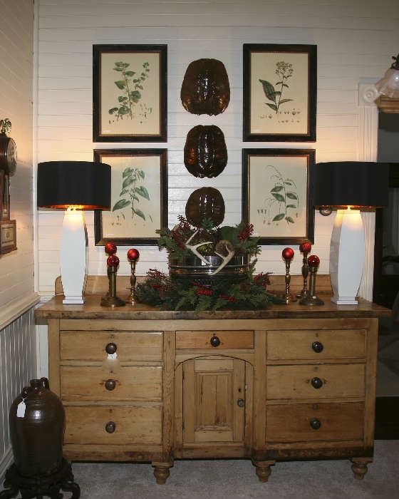 Antique Pine server from France decorated for the holidays with deer antlers, pine cones, greens and berries.