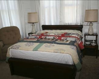 QUILTS ON ANTIQUE OAK BED