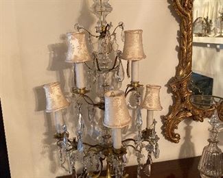Pair of five-light girandoles, metal frames with drop crystals, early 20th century.