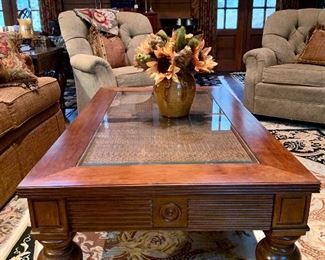 Bassett Furniture - coffee table with two matching end tables. Great turned wooden legs with casters, glass atop rattan.
