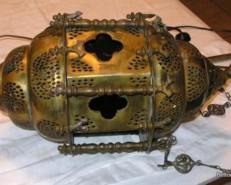 Turkish Lantern, hangs and has different colors in the holes