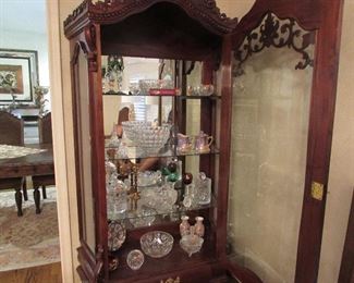 Lots of pretty glassware. Lighted cabinet
