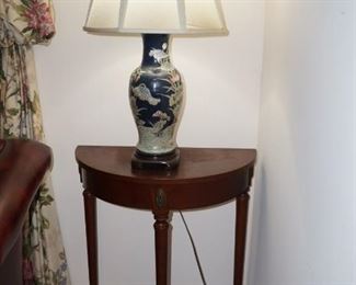 Lovely half round table and oriental lamp