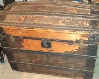 Tatty old trunk.  Use as decor or add the hinge and you've got storage