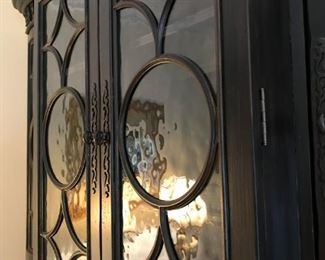 Glass door detail on Hooker breakfront cabinet