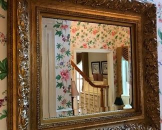 Ornate, gilded, decorative wall mirror