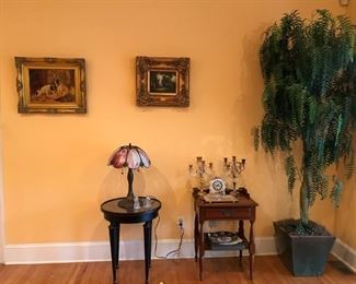 Framed oil paintings, 1920s slag glass lamp, occasional tables, more