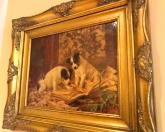 Decoratively framed English oil painting of puppies