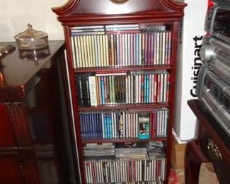 CHINA CABINET WITH TONS OF CD'S. PLUS THERE ARE A TON OF RECORDS