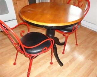 CUTE PEDESTAL TABLE AND RED WROUGHT IRON CHAIRS