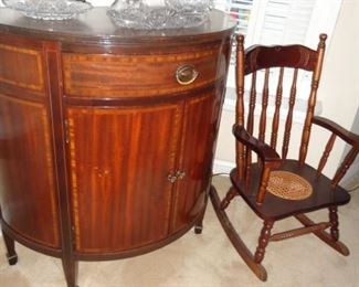 Half round buffet table and child's rocking chair,