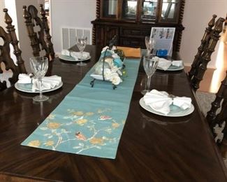Dining table with six chairs, an extension and armoire. Does not include table setting/decor or plants in armoire.