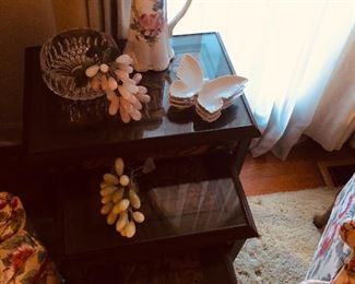 Beautiful jade grapes resting on a set of hand carved stack tables