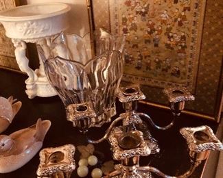 Beautiful silver plate candlesticks next to modern glass bowl and check out the cherub pedestal compote in back