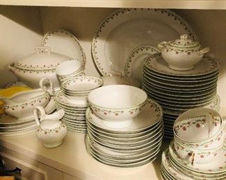 Huge set of beautiful china. Small pink flowers with a light green trim