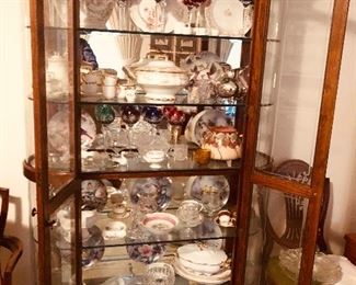 A large display cabinet that lights. Filled with Antiques and collectibles