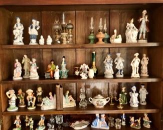 Miniature lamps, porcelain book ends, Hummel, china and brass collectibles. 