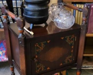 tobacco stand embellished with painted design and tobacco jars. 