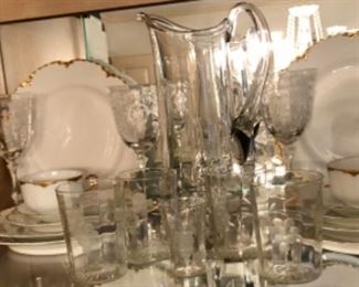 Optic glass etched stems and French Haviland china with gold trim.  