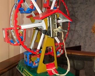 Tin fares-wheel toy, works 