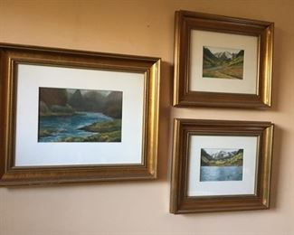 Collection of framed photographs.