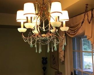 Beautiful chandelier with blue pendants.