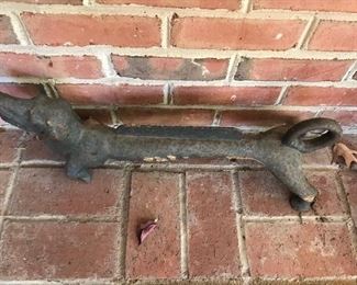 Cast iron dog boot scraper.