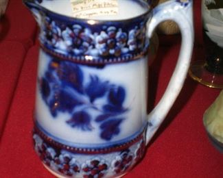 flow blue milk pitcher with gold decoration