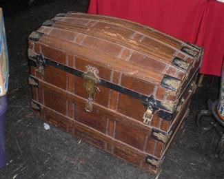 lg. oak strapped camel back trunk with brass lock