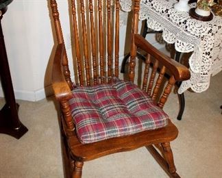 Antique rocking chair with carved wolves