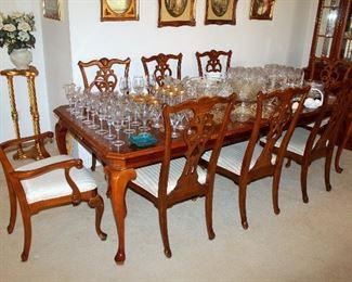 Beautiful dining table with 2 leaves and 8 chairs - also having matching china cabinet and buffet