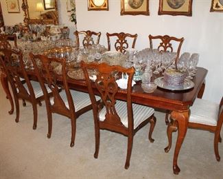 Beautiful dining table with 2 leaves and 8 chairs - also having matching china cabinet and buffet