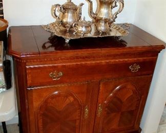 Beautiful buffet - also having matching dining table with 8 chairs and china cabinet, silverplate tea set