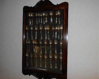 Sterling Silver spoon collection in solid wood cabinet