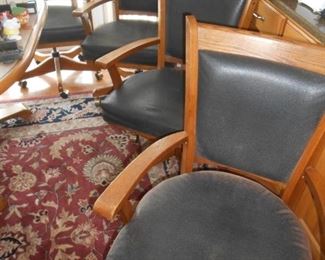 (4) wood trimmed rolling chairs, very solid sit