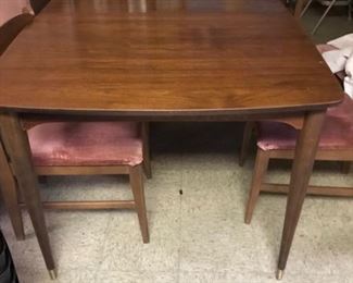 mid-century dining table.   2 leaves + 7 side chairs, 1 armchair