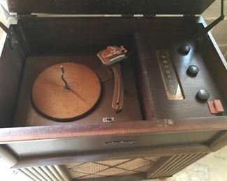 RCA stereo/record player interior.  Stylus is there but the cord is in really bad shape so we did not plug it in