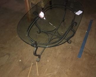 Oval Smoked Glass Cocktail Table with a Wrought Iron Base