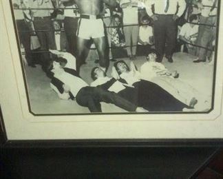 The Beatles laying on the Practice Ring with Cassius Clay / Muhammad Ali standing above them, in Miami in 1963.  This was signed by Muhammad Ali /Cassius Clay and Documented by Ross Galleries.  Highly Collectible and I will Accept Offers, above $5,000.00.  