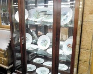 Super mahogany Chippendale china cabinet has beveled glass in front panels