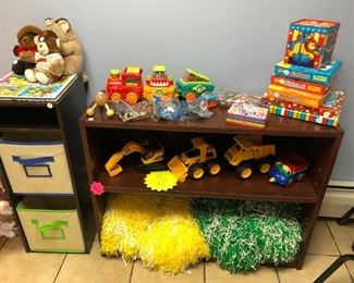 Toys and bookcases, Cheer pom poms, CAT trucks, train , puzzles, jack in a box, bears