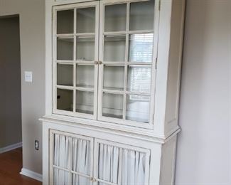 This hutch is so beautiful stands 88x47x 16 3 1/4 no scratches perfect condition. 5 shelves. 4 glass doors and attacked privacy curtains on the bottom