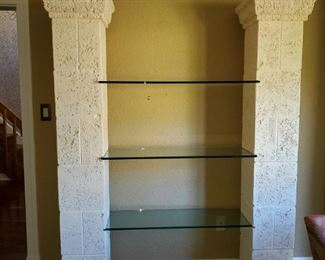 This entertainment center is like new. Is beautiful stone with 3 thick glass shelves. Columns are 80inx11x12 glass shelves are 40 in long