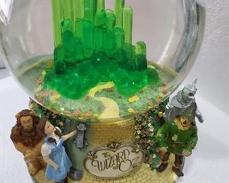 Very vintage the original wizard of oz glass globe with the emerald city inside does glow but the batteries get a little warm