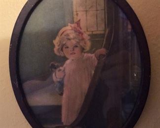 Antique small oval girl with puppy.