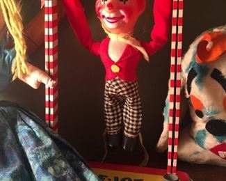 Toe Joe; a mechanical type tin toy that shows off by doing tricks. What a clown.