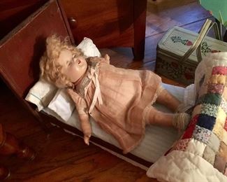 Vintage doll in bed