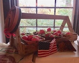 Wood garden carrier full of strawberries